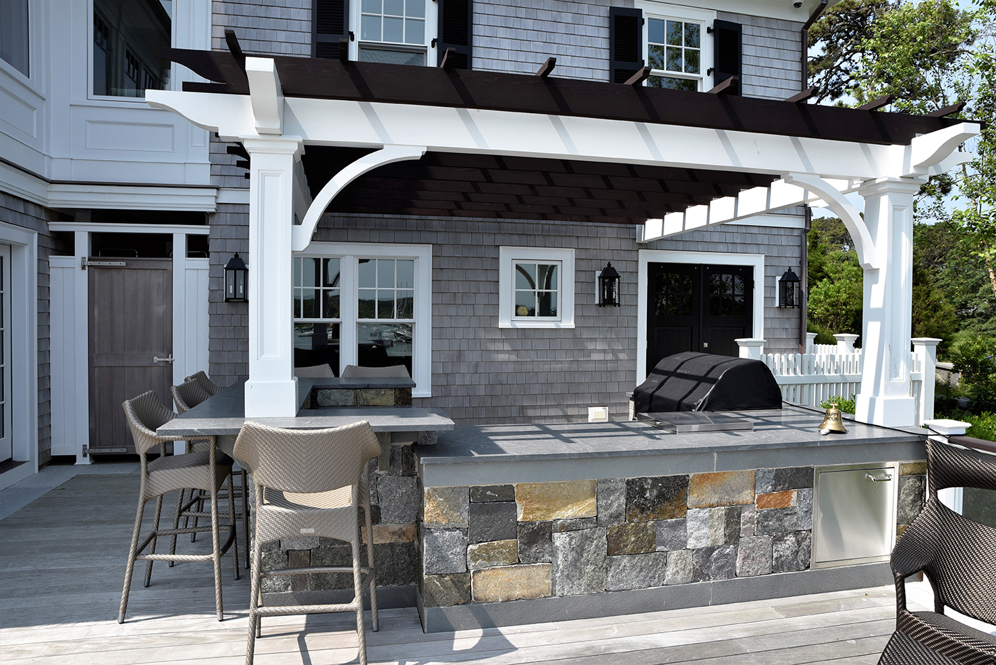 close up of outdoor kitchen with pergola
